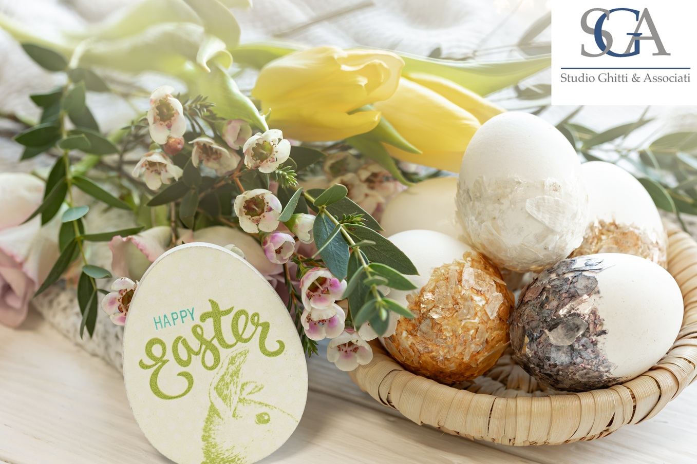 Festive Easter composition with stylish decorative eggs and flowers, close-up.